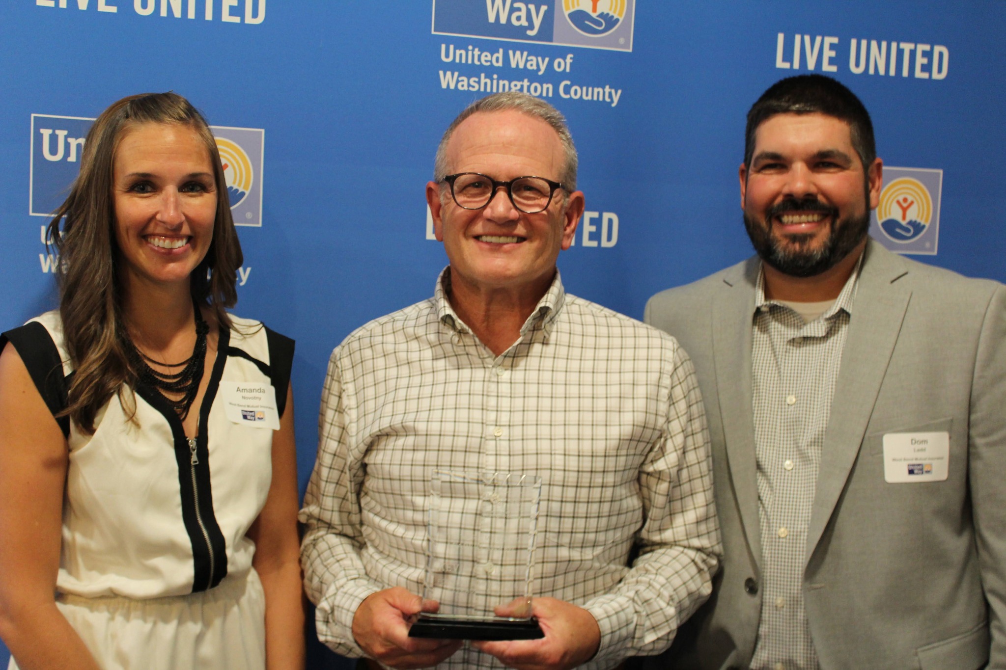 Amanda Novotny and Dominic Ladd with Kevin Steiner, the first winner of the Steiner Leadership Award.