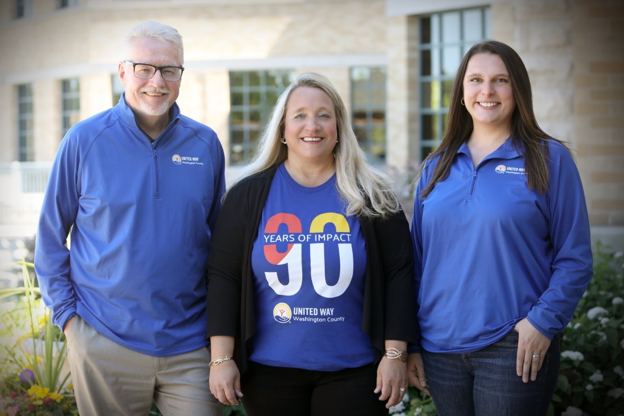 Jim Schwalen, Board President of United Way of Washington County stands to the left of Kristin Brandner, CEO of United Way of Washington County. Sarah Stadler, Emerging Leader and Alumni Co-Chair, stands to the right of Kristin. This group will lead the 2026 United Way campaign.