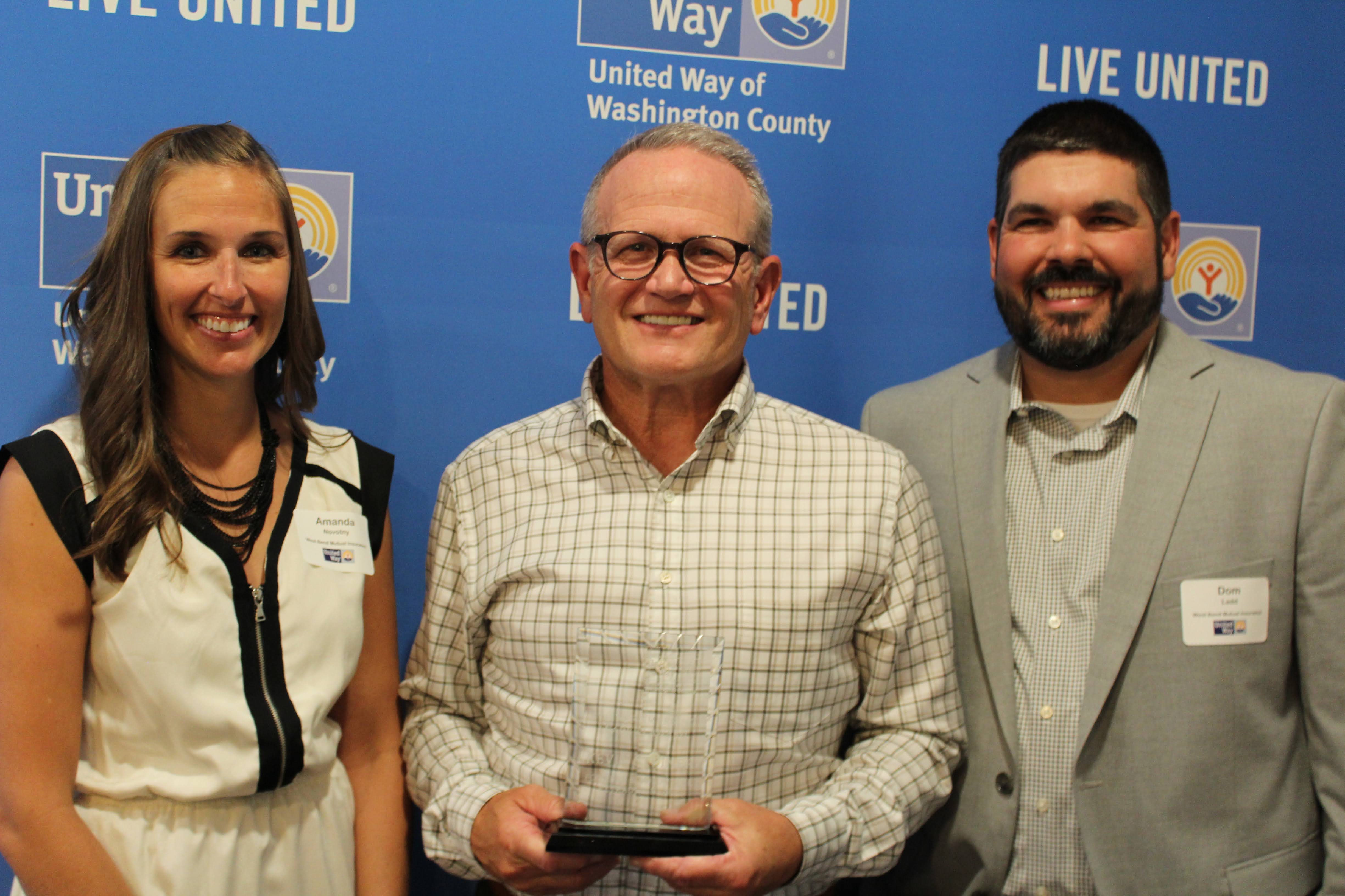 Photo of Emerging Leaders Amanda and Dominic with Kevin Steiner.