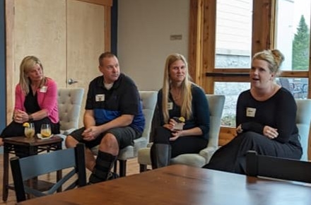 Panelists from the 2024 United Way Emerging Leaders Entrepreneur Sip event sit before attendees answering questions.
